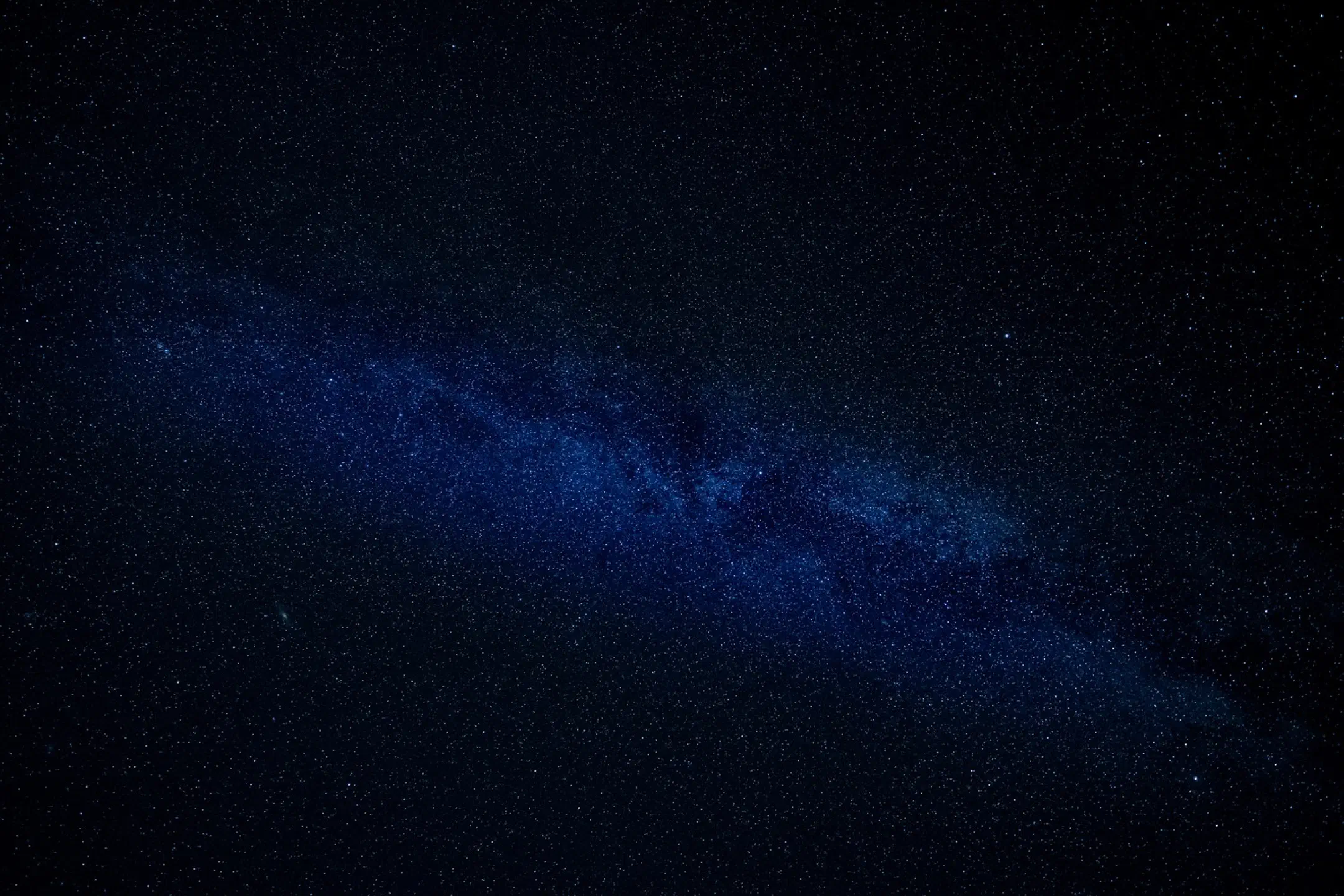 Milky Way over thatched house