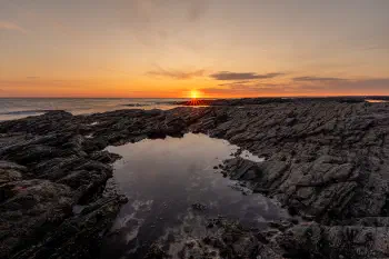 Sunbeams kiss the coast