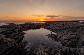 Sunbeams kiss the coast