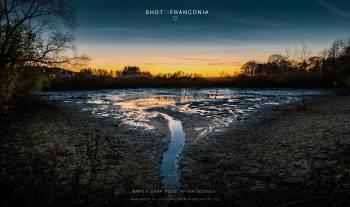 Empty carp pond after sunset