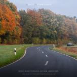Windy road through autumn landscape
