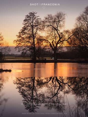 Reflections in partly frozen lake