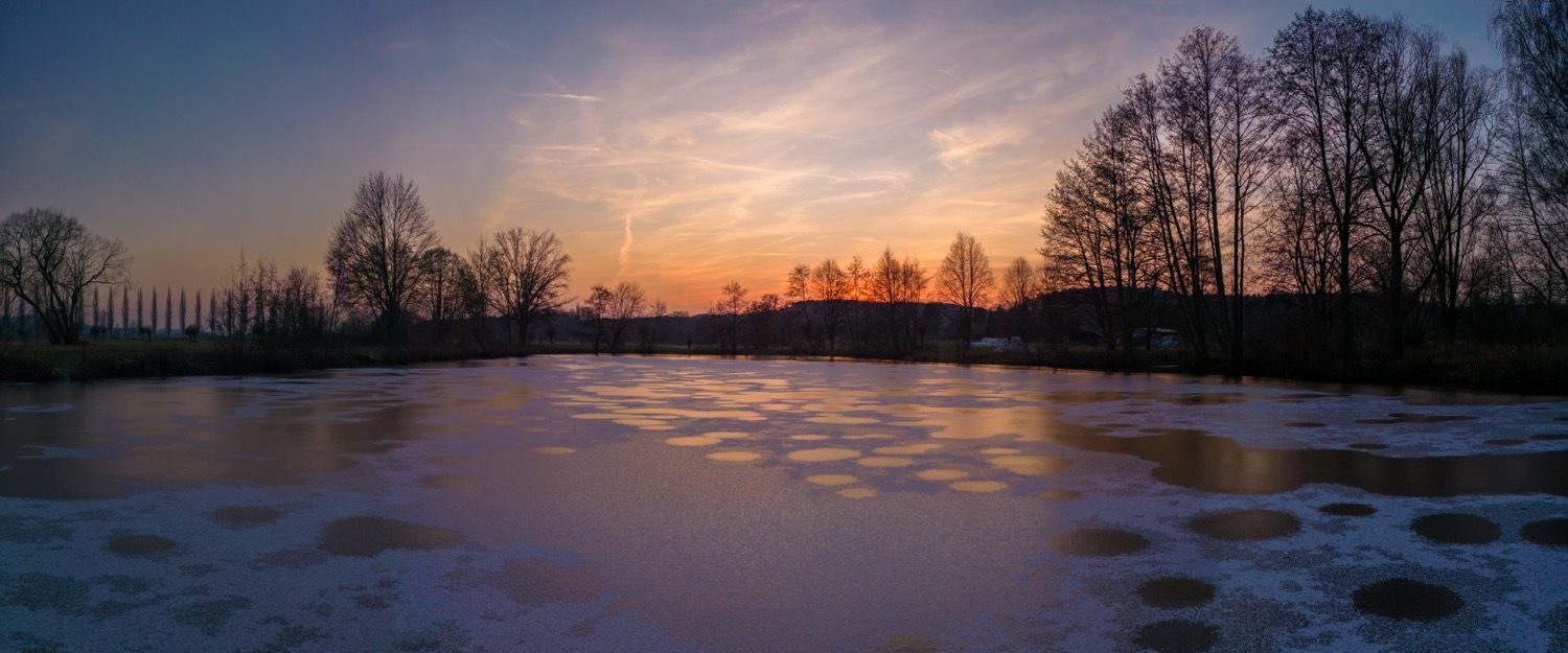 After sunset over the frozen lake