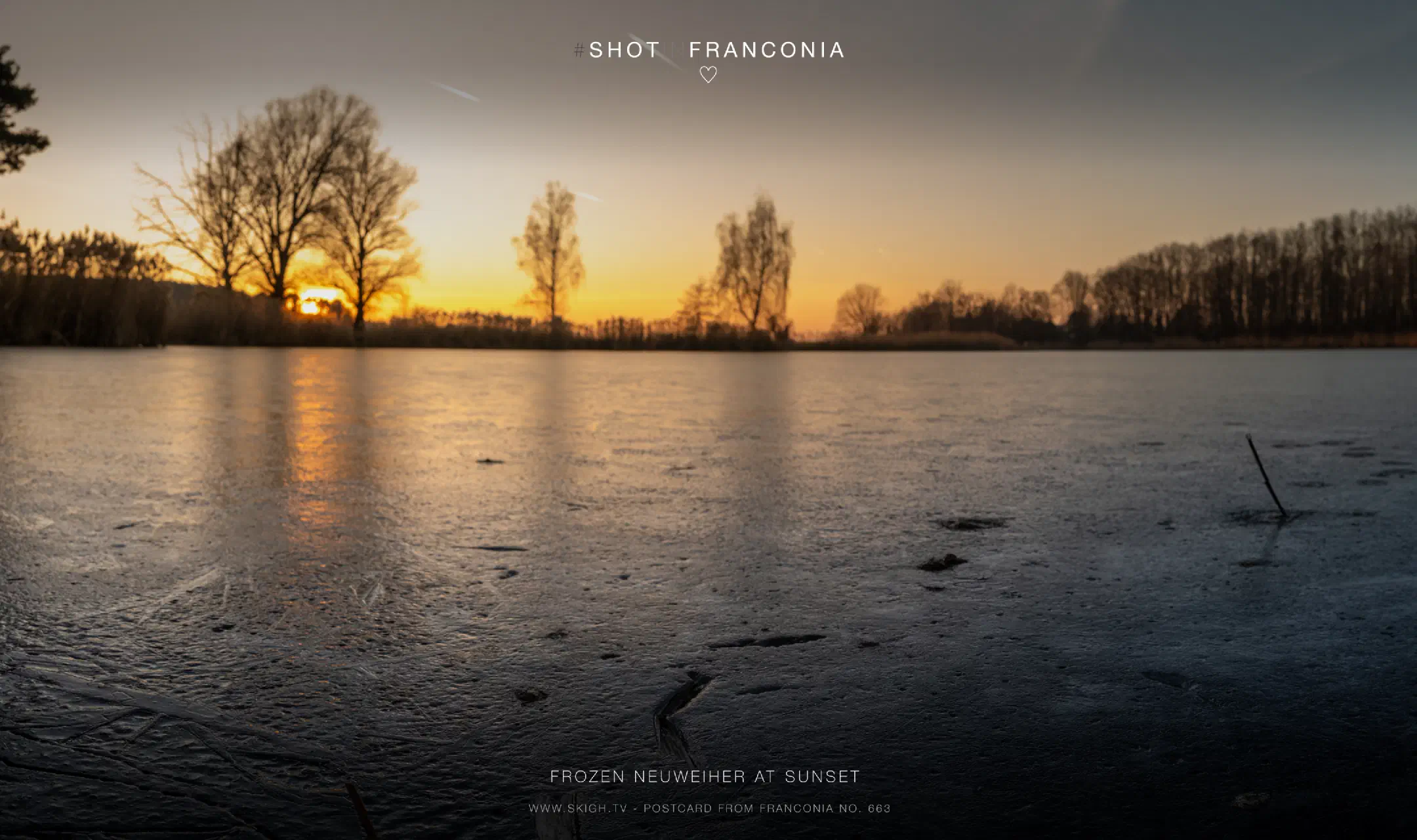 Frozen Neuweiher at sunset
