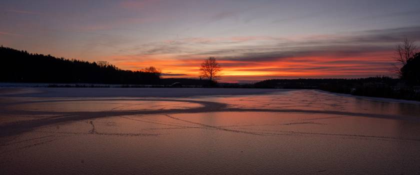 Frozen lake after sunset