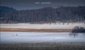 Walk across fields powdered with snow